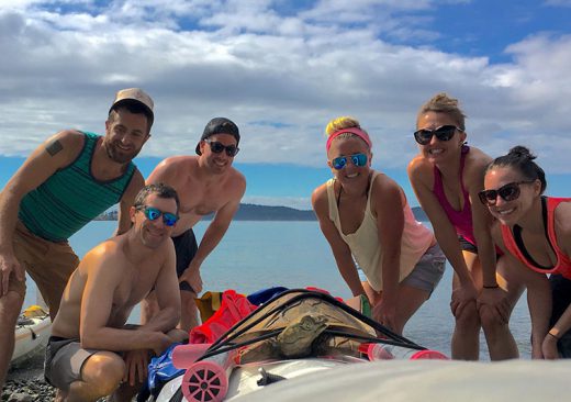 Kayaking group posing on a sunny day